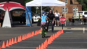 Rider cross the bike rodeo finish line