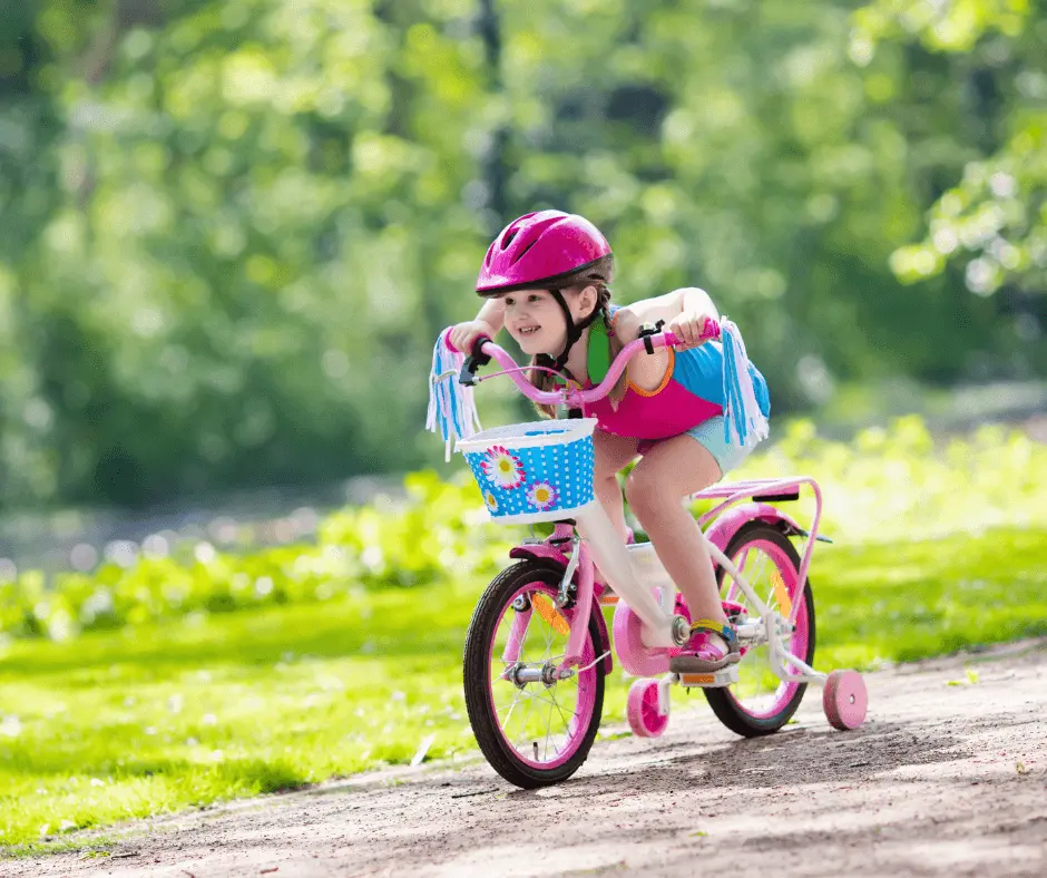 Young child riding bike on trail